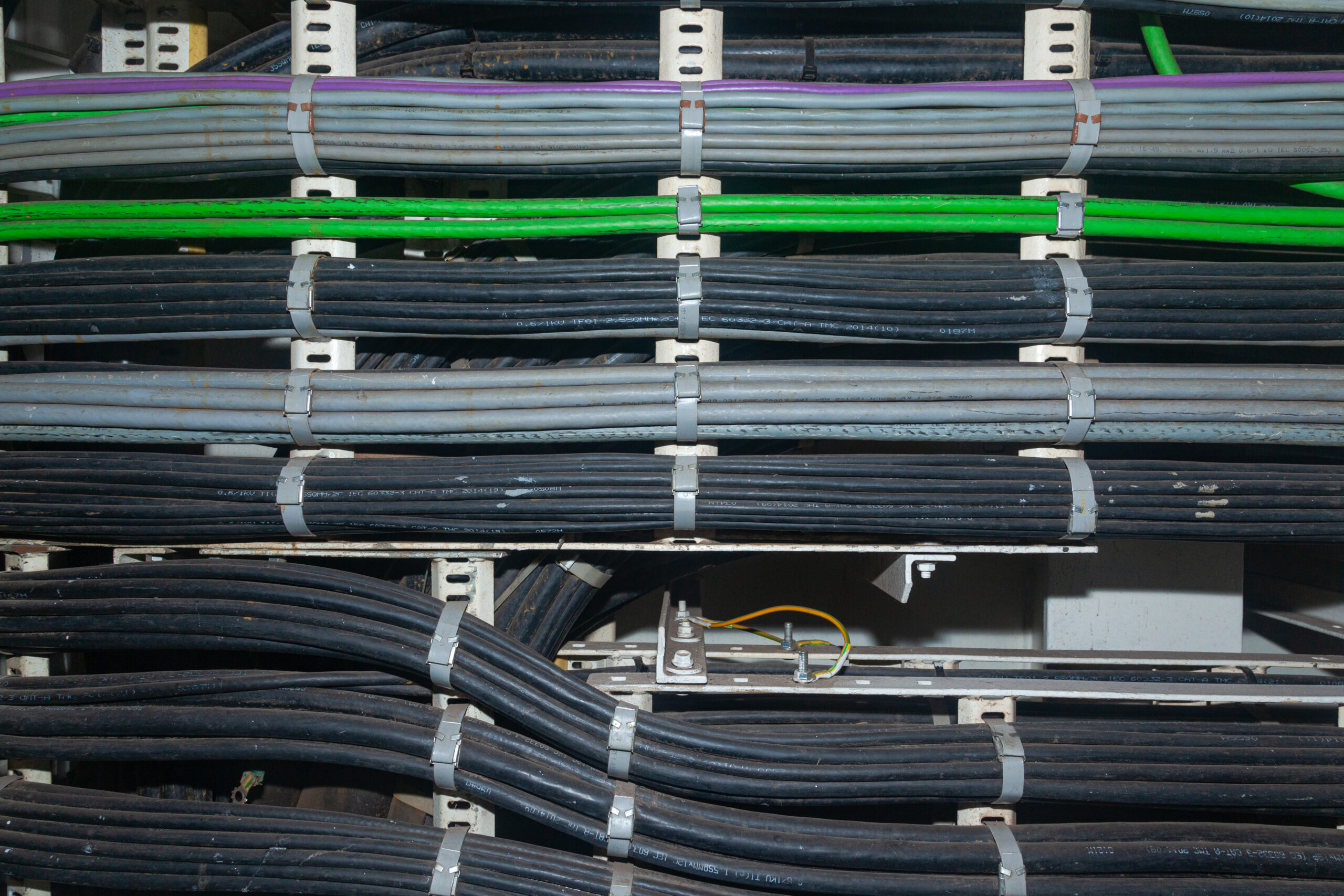 Line of installed industrial electrical cables.